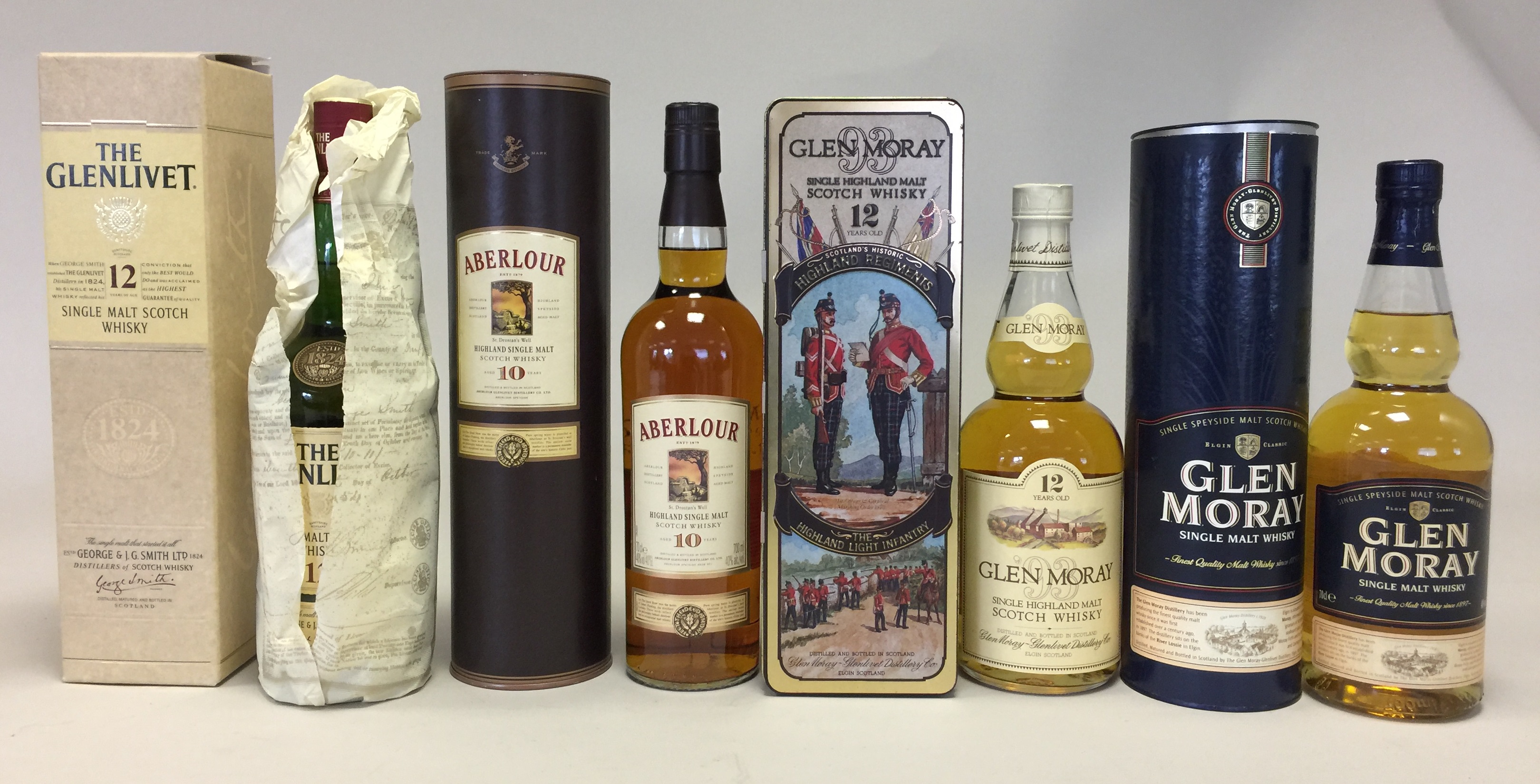 SINGLE MALTS - 4 boxed bottles of 70/75cl single malt whisky to include: Glen Moray 12 years old,