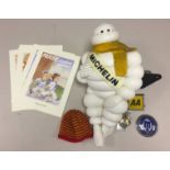 MICHELIN MAN WITH HAT AND SCARF. A plastic Michelin Man model on adjustable base.