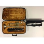 MUSICAL INSTRUMENTS - To include three instruments and two carry cases: A Corton trumpet with two