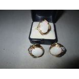 A good quality 20th century earring and ring set, comprising of three large opals (each 1.