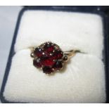9 ct gold ring set with a cluster of garnets 2 g size 54
