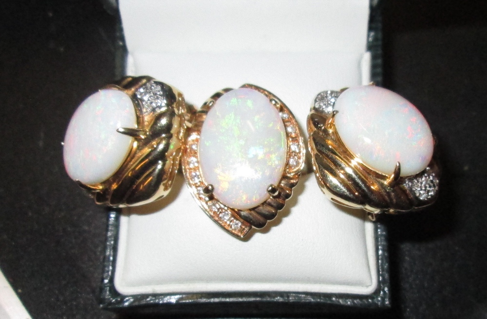 A good quality 20th century earring and ring set, comprising of three large opals (each 1. - Image 2 of 3