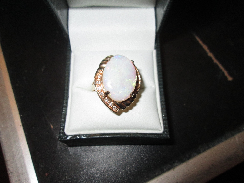 A good quality 20th century earring and ring set, comprising of three large opals (each 1. - Image 3 of 3
