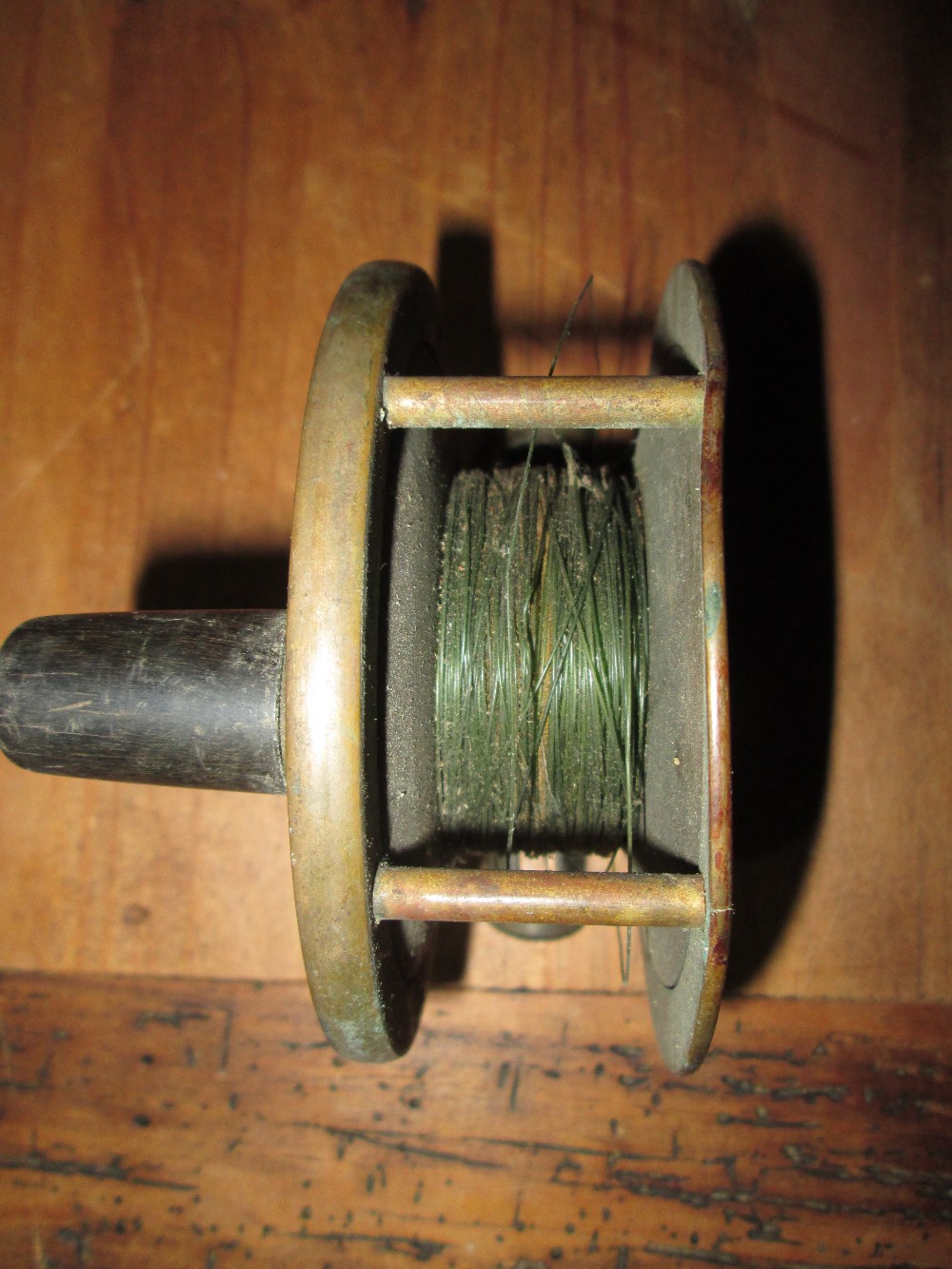 Early 20th century Hardy brass fishing reel 10 cms diameter, - Image 4 of 5