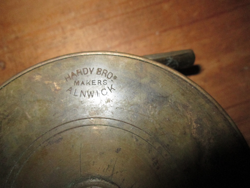 Early 20th century Hardy brass fishing reel 10 cms diameter, - Image 3 of 5