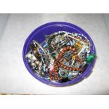 Bowl of assorted costume jewellery