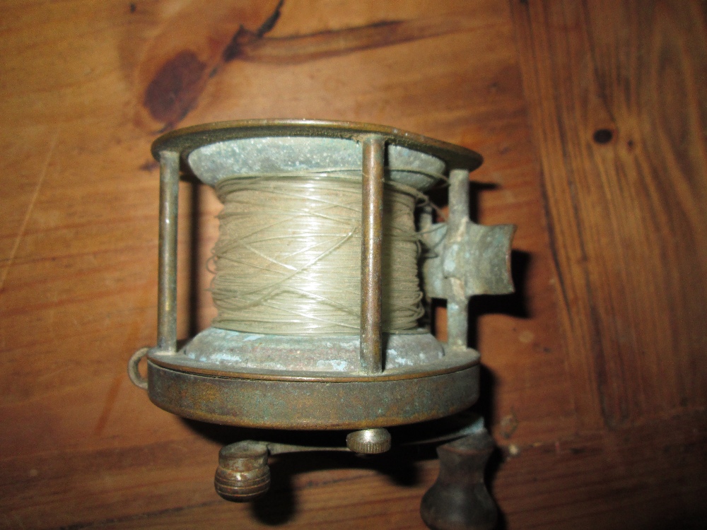 Early 20th century Hardy brass fishing reel 10 cms diameter, - Image 5 of 5