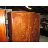 Early 20th century marquetry and parquetry French exotic wood serpentine front armoire