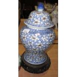Antique Chinese baluster shape blue and white vase & cover with floral decoration on wooden stand