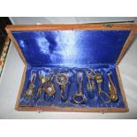 Unusual brass maritime key rings in hardwood box