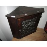 Late 19th century carved oak corner cupboard