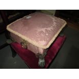 Edwardian footstool with brass hairy claw feet