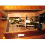 Early 20th century microscope in hardwood case