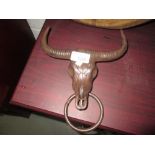 Cast metal cow head door knocker