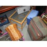 Glass top coffee table, suitcases,