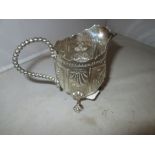 Solid silver cream jug with repousse foliate decoration on three scallop feet Sheffield 1865
