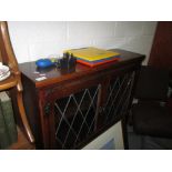 Carved oak leaded and glazed bookshelves