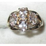 Modern 9 ct gold ring set with 4 off pink stones Birm.