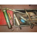 Garage workshop tools : grease guns, levers, advertising spirit can (AF),