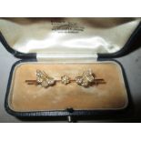 14 ct gold bar brooch modelled as butterflies set with seed pearls 2.