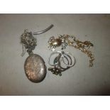 Silver photo locket, silver chains, earrings, gold plated brooch etc.