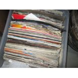 Box of assorted records albums and 12 inch singles suffering effects of inappropriate storage
