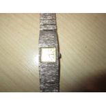 Vintage ladies wristwatch by Empress of Switzerland with silver case and strap