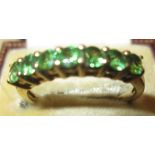 Modern 9 ct gold ring set with 7 bright coloured emeralds size 53 , 2.