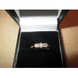 18 ct gold ring set with three diamonds size 53 1.