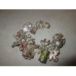 Vintage silver charm bracelet with 25 different charms 100 g : rocking chairs, carriage, £ 1 note,