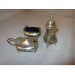 Solid three piece silver cruet set with blue glass liner Birm.