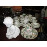 Decorative china tea sets, glassware, plaster cherub figure etc.