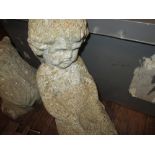Composite stone figure of a cherub,