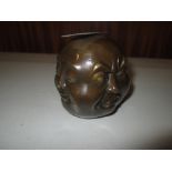 Bronzed metal Chinese four faces paperweight