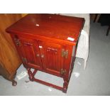 20th century carved oak linenfold cupboard