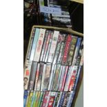 2 x boxes of assorted DVDs & videos