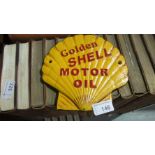 Cast iron advertising sign : Golden Shell