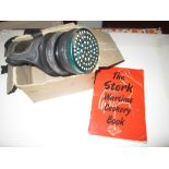 World War II gas mask & single volume Wartime Cookery