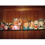Shelf of assorted character jugs