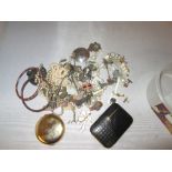 Box of odd costume jewellery, compact simulated pearls etc,