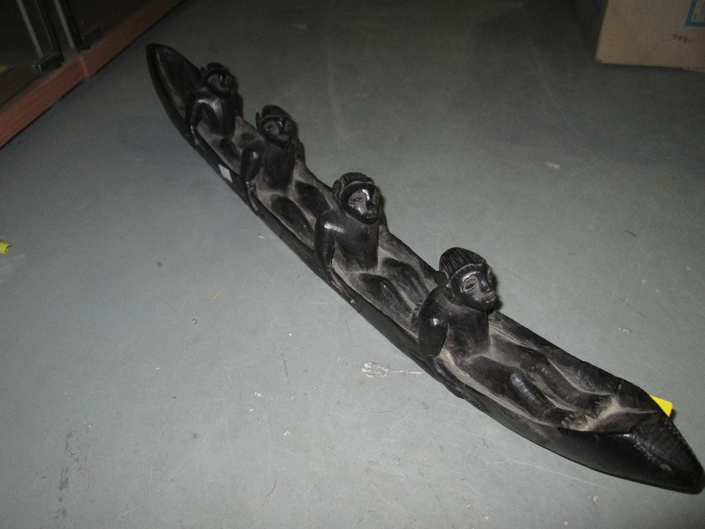 Carved African hardwood Men in Canoe ornament (tribal interest)