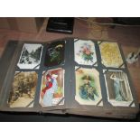 Early 20th century postcard album with in excess of 450 postcards,