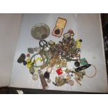 Bag of assorted costume jewellery, medallions, wristwatches etc.