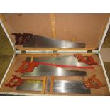 Carpenters chest of saws including : Disston 26" rip saw, Tyzack tenon saw No 154 ,