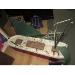 Carved and painted wooden boat ornament