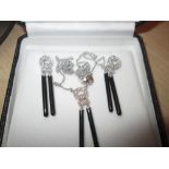 An elegant Art Deco style 18 ct white gold and diamond earring and necklace set with black jet