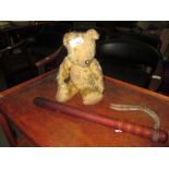 Vintage teddy bear and truncheon