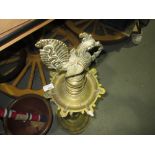 Early 20th century Indian brass rush candle stand modelled with bird finial