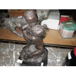 Bronzed metal figure of children at play