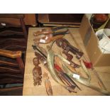 Assorted African carved tourist ware ornaments: spears, deers heads,